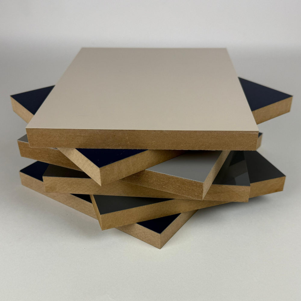 Stack of laminated MDF panels, featuring a smooth high-gloss finish and exposed brown MDF edges, ideal for cabinets, furniture, and wall panels.