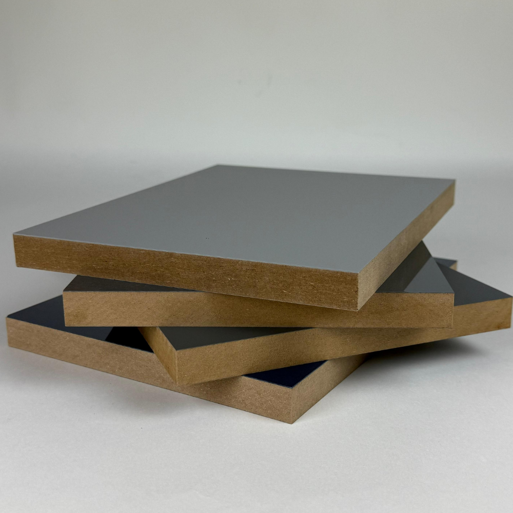 Stack of laminated MDF panels, featuring a smooth high-gloss finish and exposed brown MDF edges, ideal for cabinets, furniture, and wall panels.