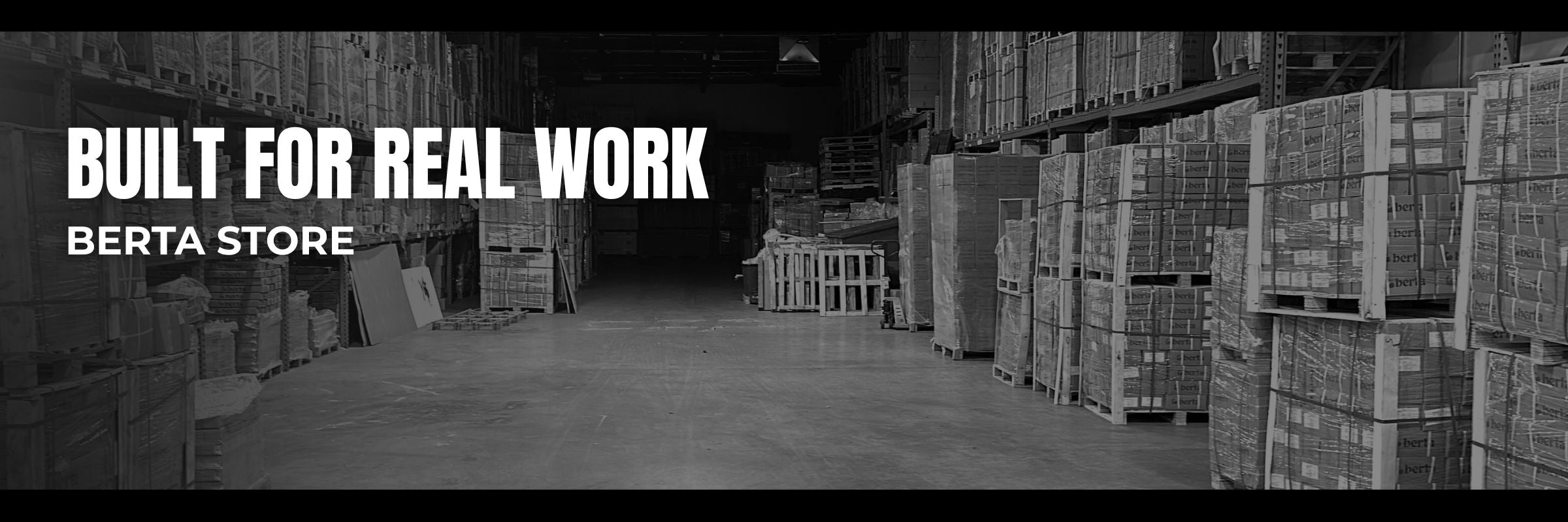 Warehouse interior with stacked building materials and pallets