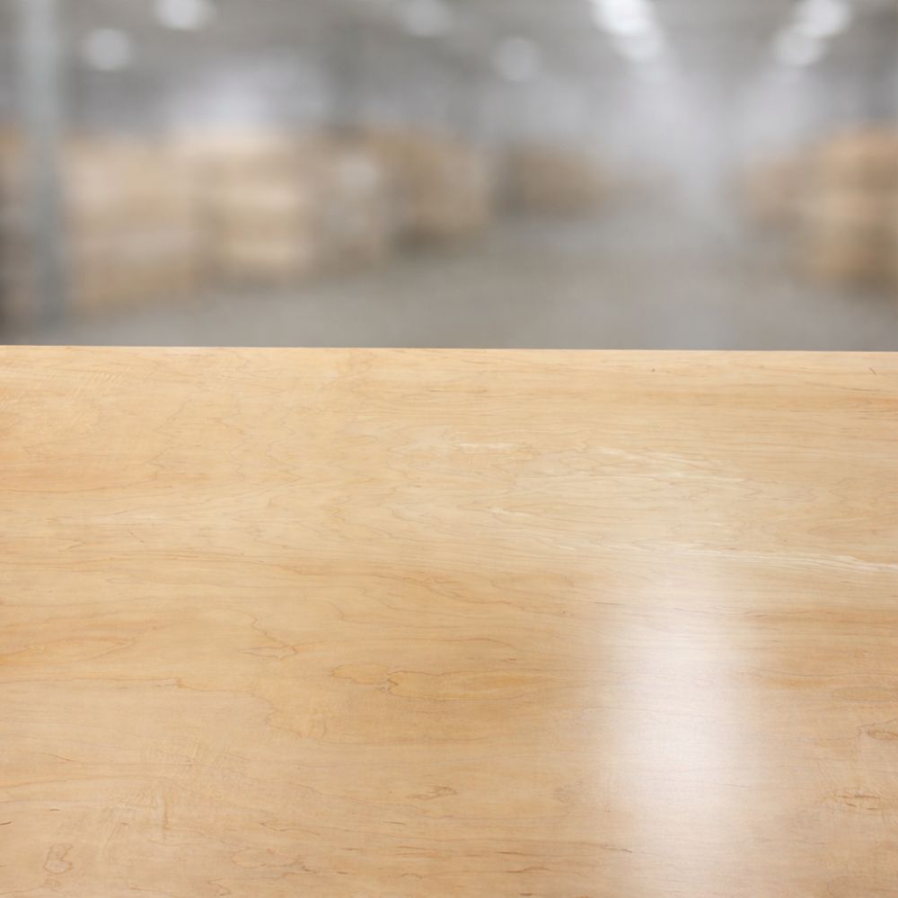 Smooth prefinished maple plywood surface with consistent grain and factory finish