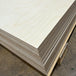 Stack of B/BB Baltic Birch plywood 4×8 panels in 3/4-inch thickness showing the layered Baltic birch edges.