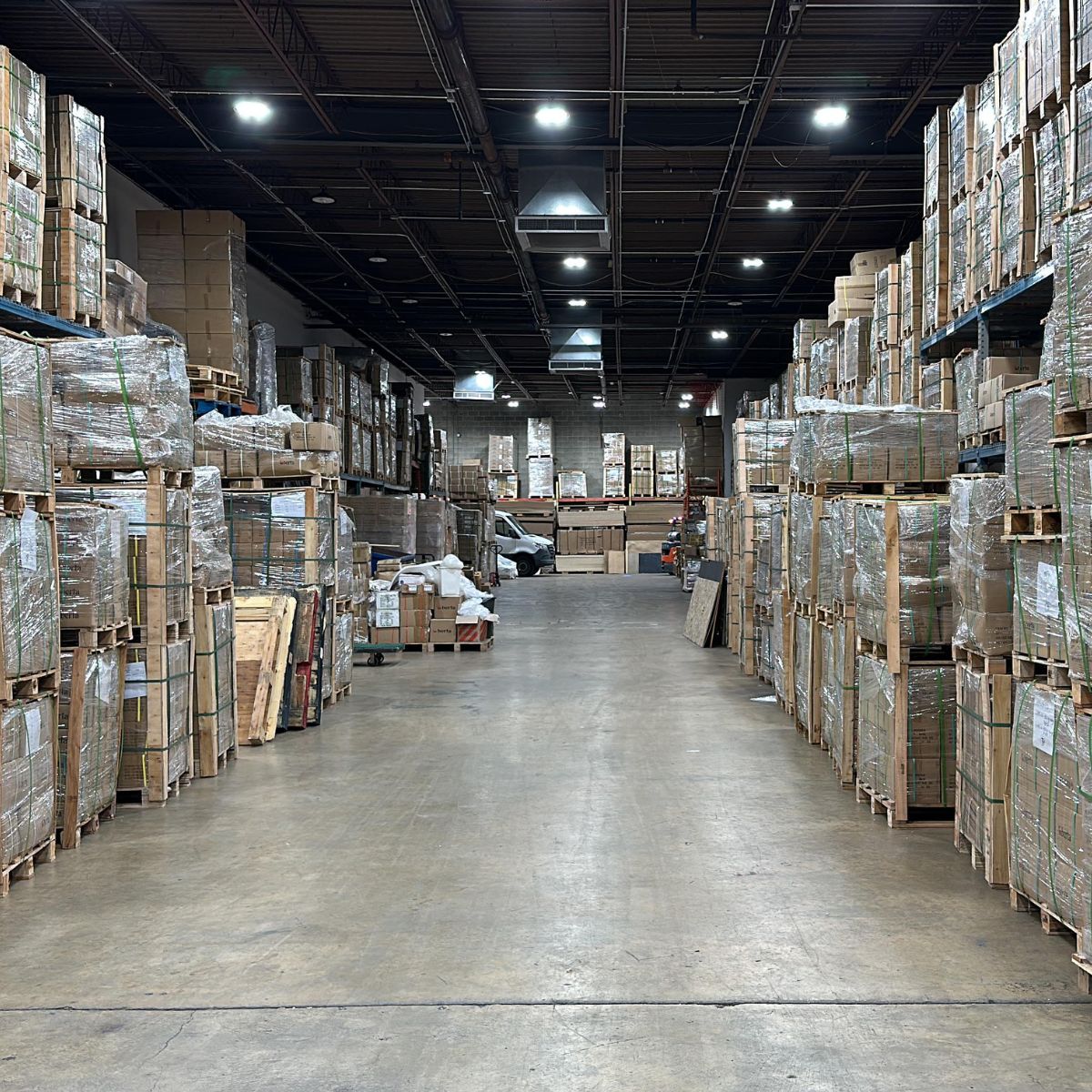 Cabinet-grade plywood sheets stored and handled inside Berta Store warehouse