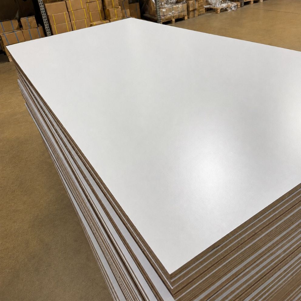 Close-up of light gray prefinished plywood with a multi-ply poplar core.