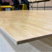 Edge view of Prefinished Birch Plywood 4x8 panel showing clean layered core and UV-coated birch surface