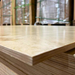 Stack of Prefinished Birch Plywood 4x8 sheets highlighting smooth UV finish and strong multi-ply birch core