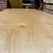Close-up of Prefinished Birch Plywood 4x8 sheet showing smooth wood grain pattern and UV-cured finish on both sides.